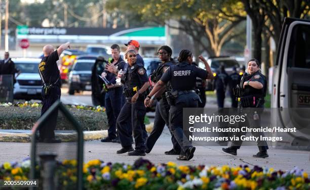 Harris County Sheriffs officers outside of Lakewood Church on Sunday, Feb. 11 in Houston, after a reported shooting during a Spanish church service.