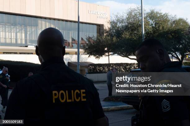 Police officers stand outside Lakewood Church during an active shooter event at the church Sunday, Feb. 11, 2024.