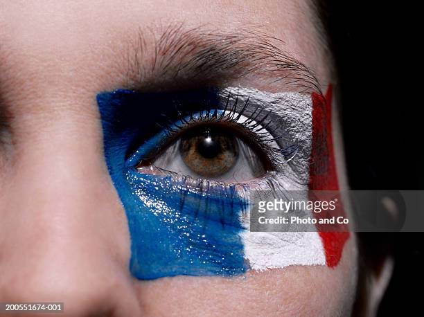 female rugby fan with french flag painted on face, close-up - cu fan - fotografias e filmes do acervo