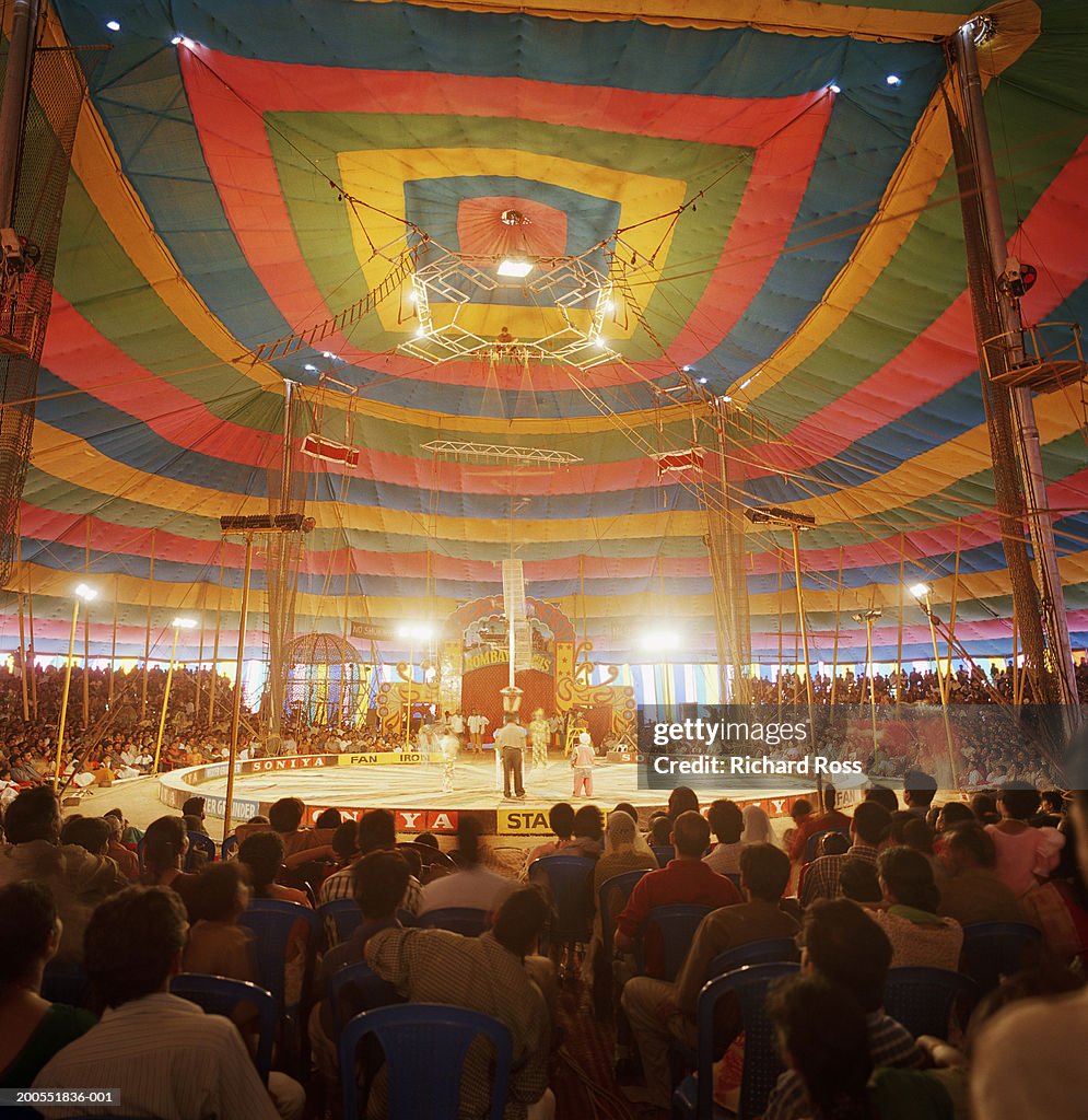 People watching circus in tent