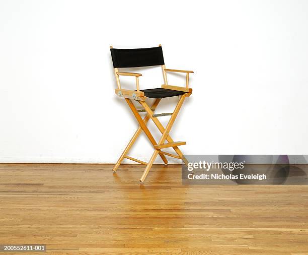 director's chair on wooden floor, close-up - director's chair stock pictures, royalty-free photos & images