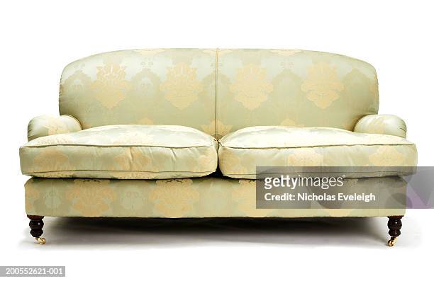 pale green couch against white background, close-up - sofa freisteller stock-fotos und bilder