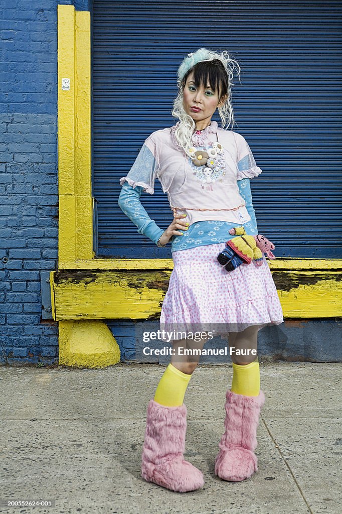 Woman wearing Harajuku style dress, hand on hip, portrait