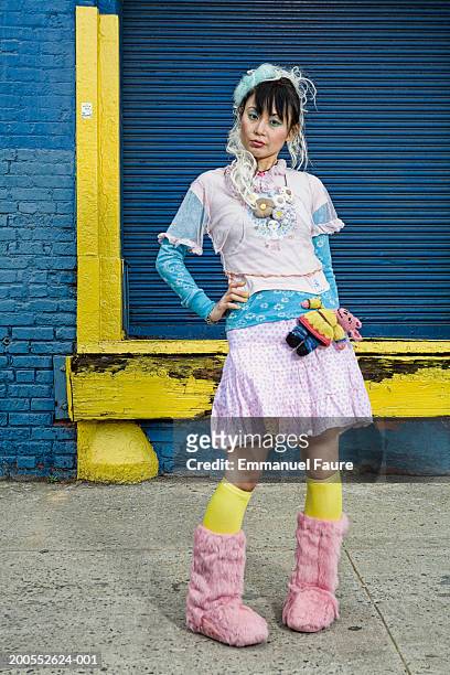 woman wearing harajuku style dress, hand on hip, portrait - tokyo fashion stock pictures, royalty-free photos & images