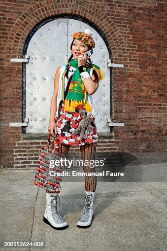 Woman using mobile phone, smiling Woman using mobile phone, smiling