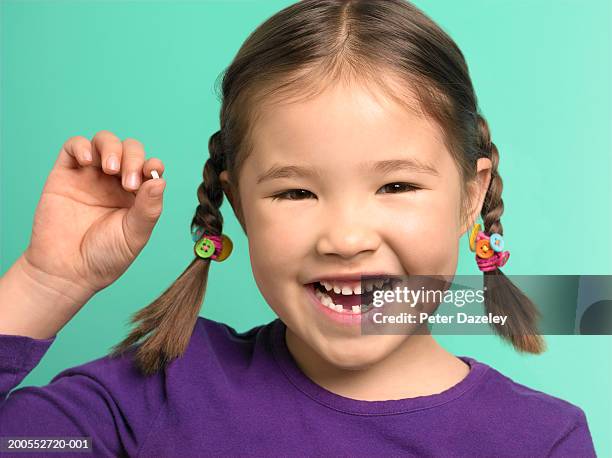 girl (6-7) showing tooth, close-up, portrait - tooth fairy stock pictures, royalty-free photos & images