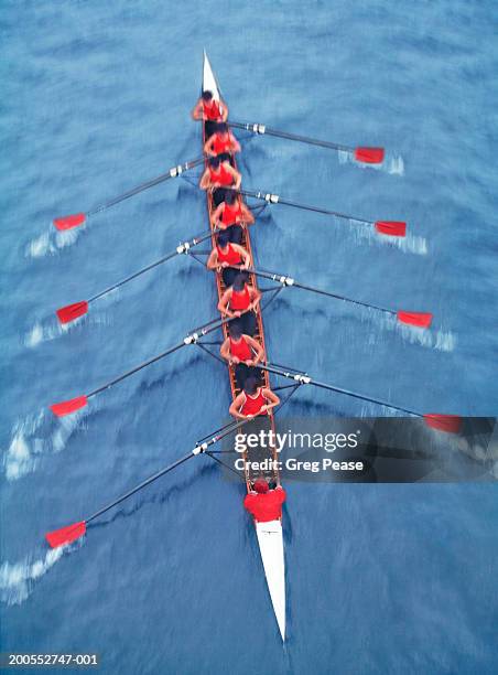 rowers in eight person-scull, elevated view (blurred motion) - rowing competition stock pictures, royalty-free photos & images