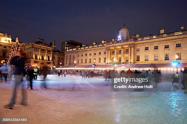 england, london, people ice skating on rink at somerset house, night - ice rink london christmas stock pictures, royalty-free photos & images