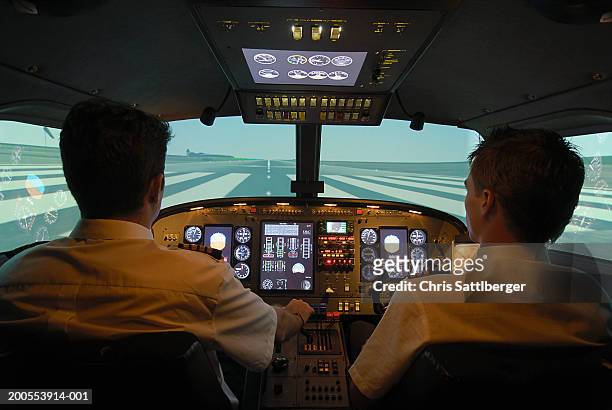 pilots taxing on airport runway - landung stock-fotos und bilder
