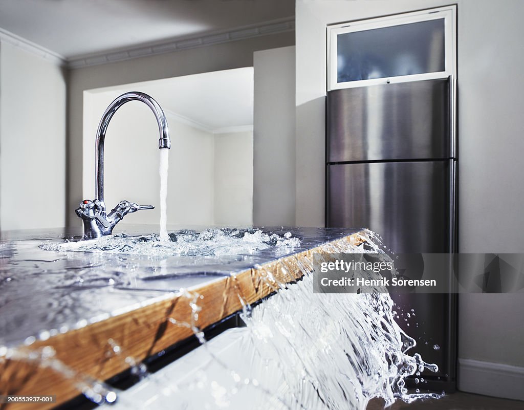 Water overflowing in kitchen sink