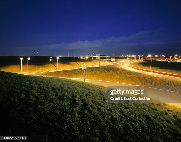 road junction at dusk (long exposure) - autoroute france stock pictures, royalty-free photos & images