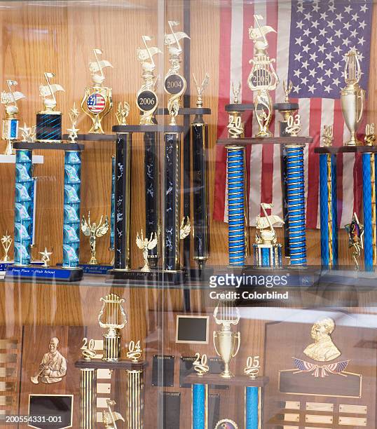 various trophies and us flag - trophy shelf stock pictures, royalty-free photos & images