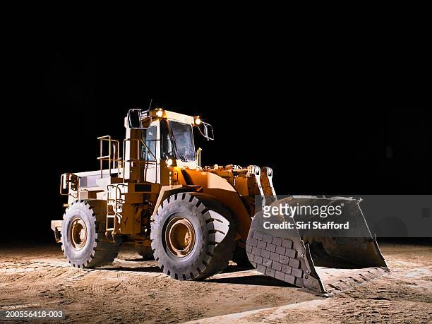 bulldozer with shovel lowered - earth mover stock-fotos und bilder