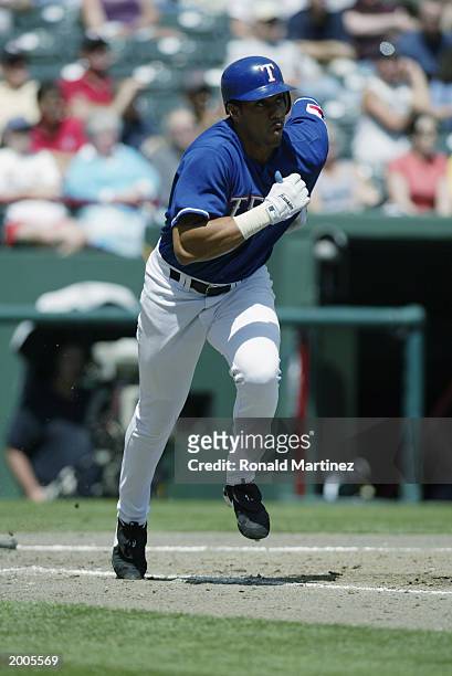 Juan Gonzalez of the Texas Rangers runs up the first base line during the game against the Oakland Athletics at the Ballpark in Arlington on April...