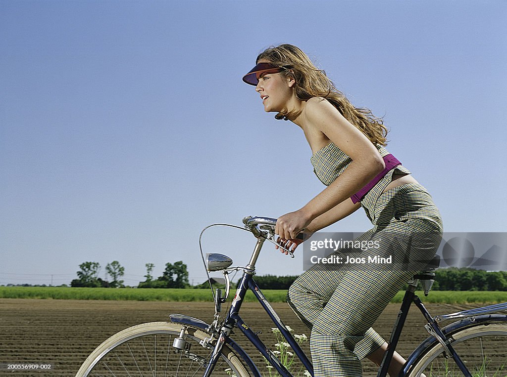 Young woman riding bike