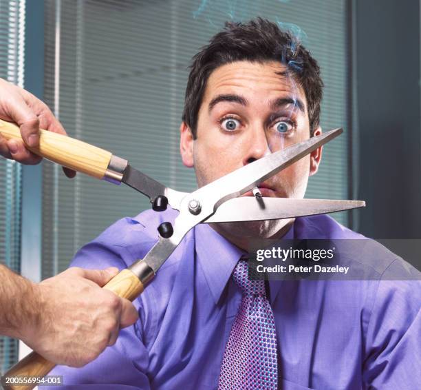 man cutting businessman's cigarette with garden shears - quitting smoking stock pictures, royalty-free photos & images