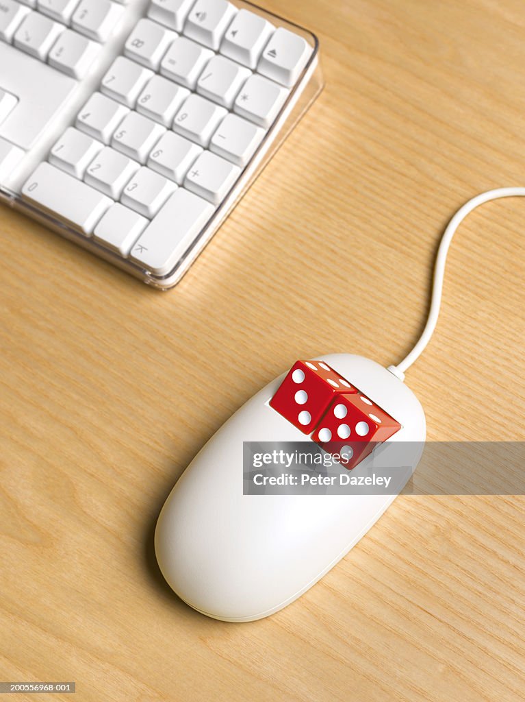 Computer mouse with dice in place of buttons, close-up