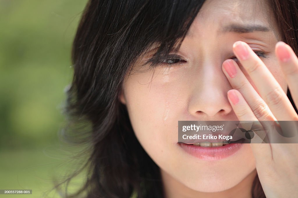 Young woman crying, close-up