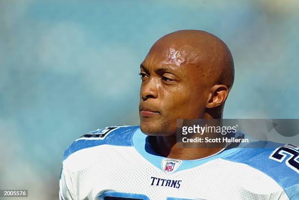 Running back Eddie George of the Tennessee Titans watches practice before the game against the Jacksonville Jaguars at Alltel Stadium on December 22,...