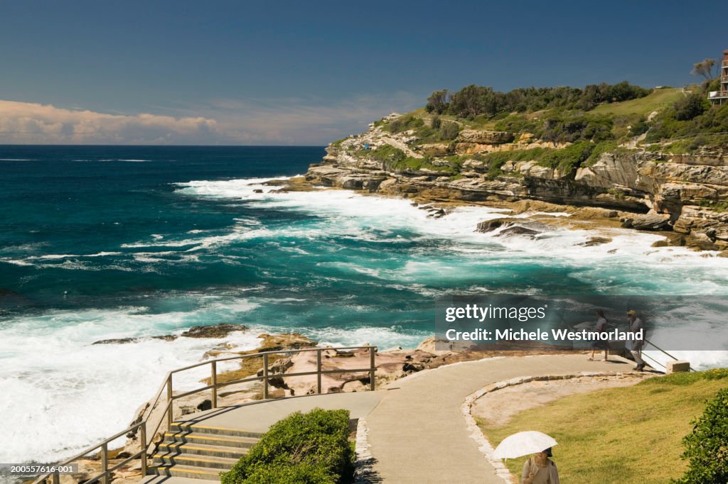 Australia, Sydney, Bondi Beach, two people walking, elevated view