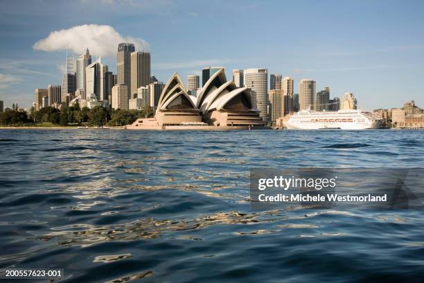 australia, sydney, opera house and city skyline seen from water - sydney opera house bildbanksfoton och bilder