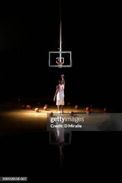 basketball player shooting free throw - basketball on court stock-fotos und bilder