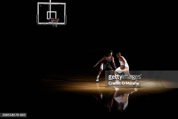 basketball players playing one on one - basketball sport stock pictures, royalty-free photos & images