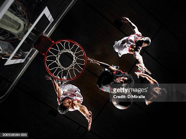 basketball player dunking ball over opponents, overhead view - shooting baskets 個照片及圖片檔