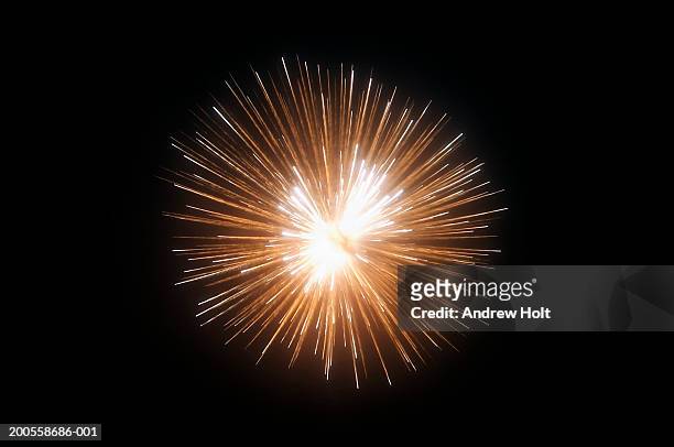 exploding fireworks against black night sky - firework stock-fotos und bilder
