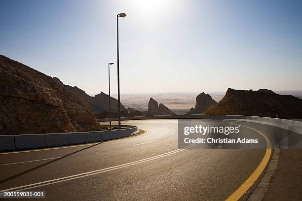 dubai, jebel hafid, road across non urban landscape - dubai road stock pictures, royalty-free photos & images