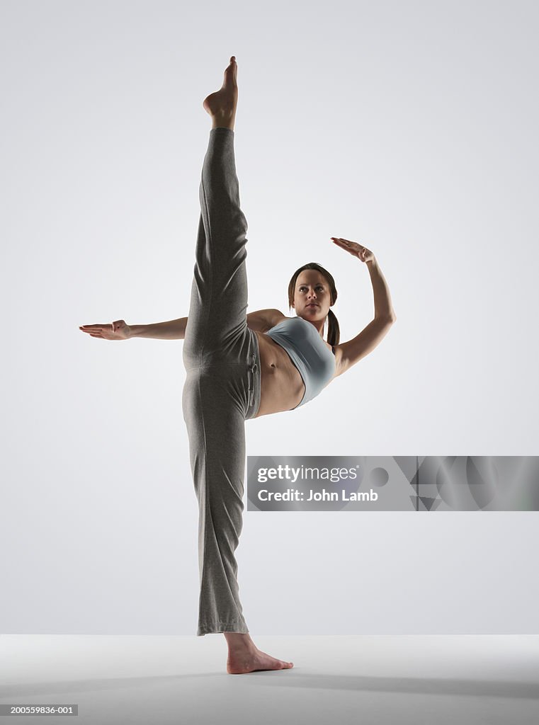 Young Woman Performing High Kick High-Res Stock Photo - Getty Images
