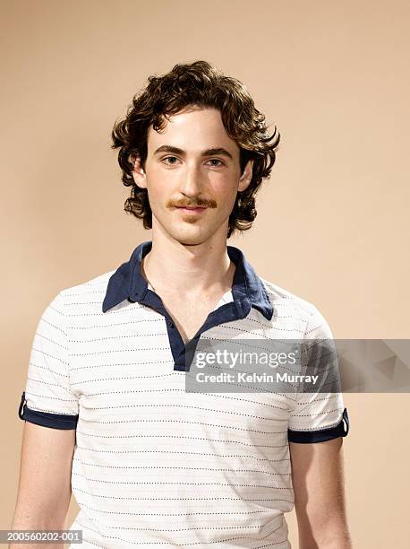 portrait of young man with moustache - moustaches stock-fotos und bilder