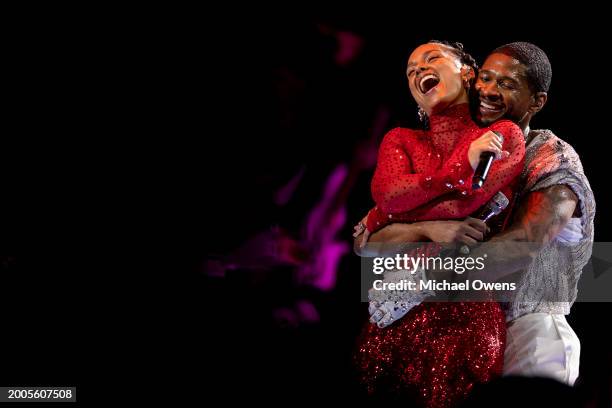 Usher performs with Alicia Keys during the Apple Music halftime show at the NFL Super Bowl 58 football game between the San Francisco 49ers and the...