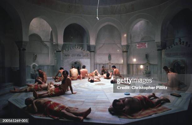 Turkey, Istanbul, people relaxing at Chemberlitas baths.