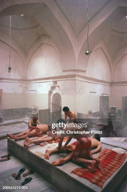 Turkey, Istanbul, people relaxing at Chemberlitas baths.