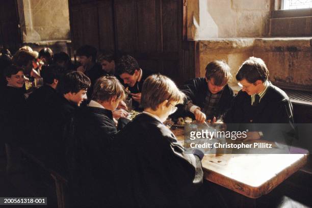 Winchester College, Wiltshire, students eating lunch.