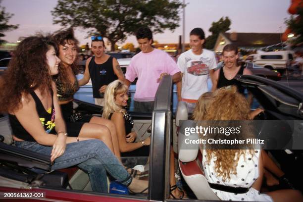 Modesto, people sitting in convertible truck, cruising, dusk.