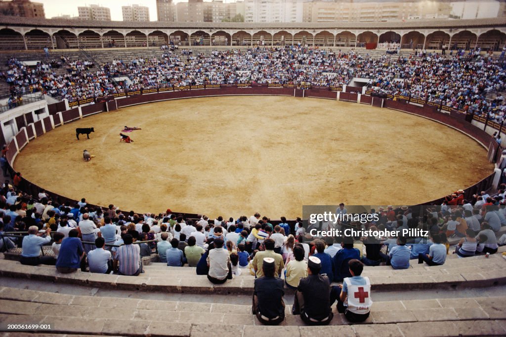 Spain, Avila, people watching bullfight in ring, elevated view