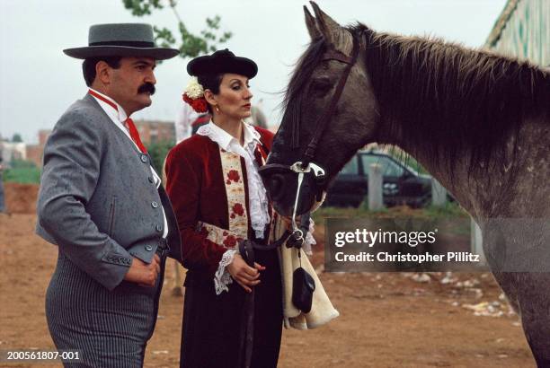 Spain, Barcelona, April Fair, matador couple with horse.