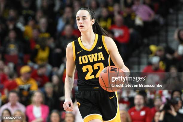 Caitlin Clark of the Iowa Hawkeyes dribbles against the Nebraska Cornhuskers in the second half at Pinnacle Bank Arena on February 11, 2024 in...