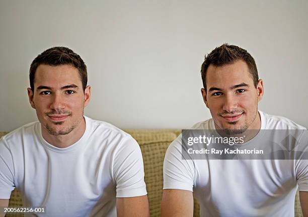 twin brothers, smiling, portrait - zwilling stock-fotos und bilder