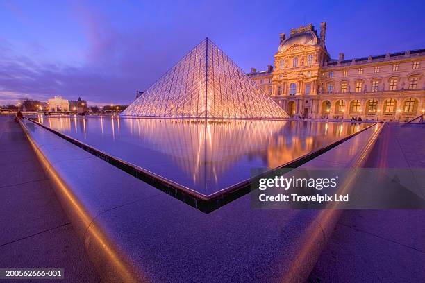 france, paris, the louvre, dusk - louvre pyramid stock pictures, royalty-free photos & images