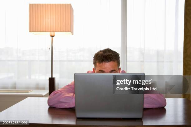 51 A Man Hiding Behind A Laptop Stock Photos, High-Res Pictures, and ...