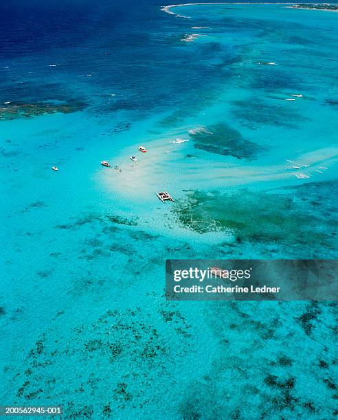aerial view boats on blue lagoon - cayman island aerial stock pictures, royalty-free photos & images