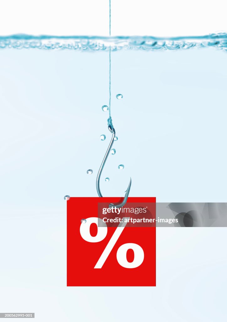 Fishhook with percentage sign in water