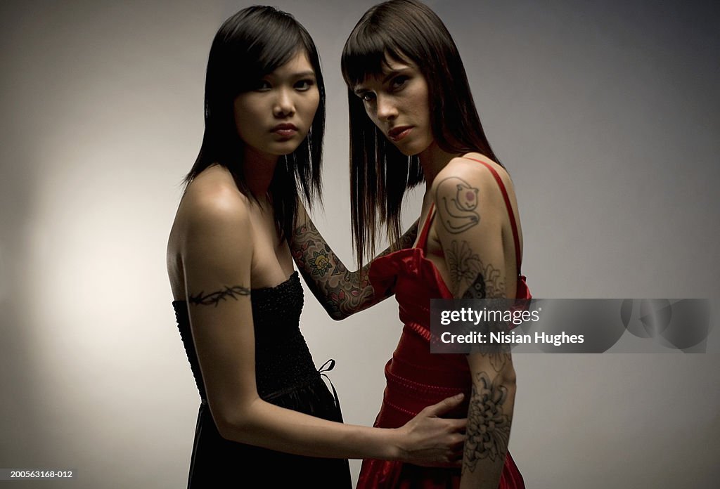 Two young women with tattoo, portrait