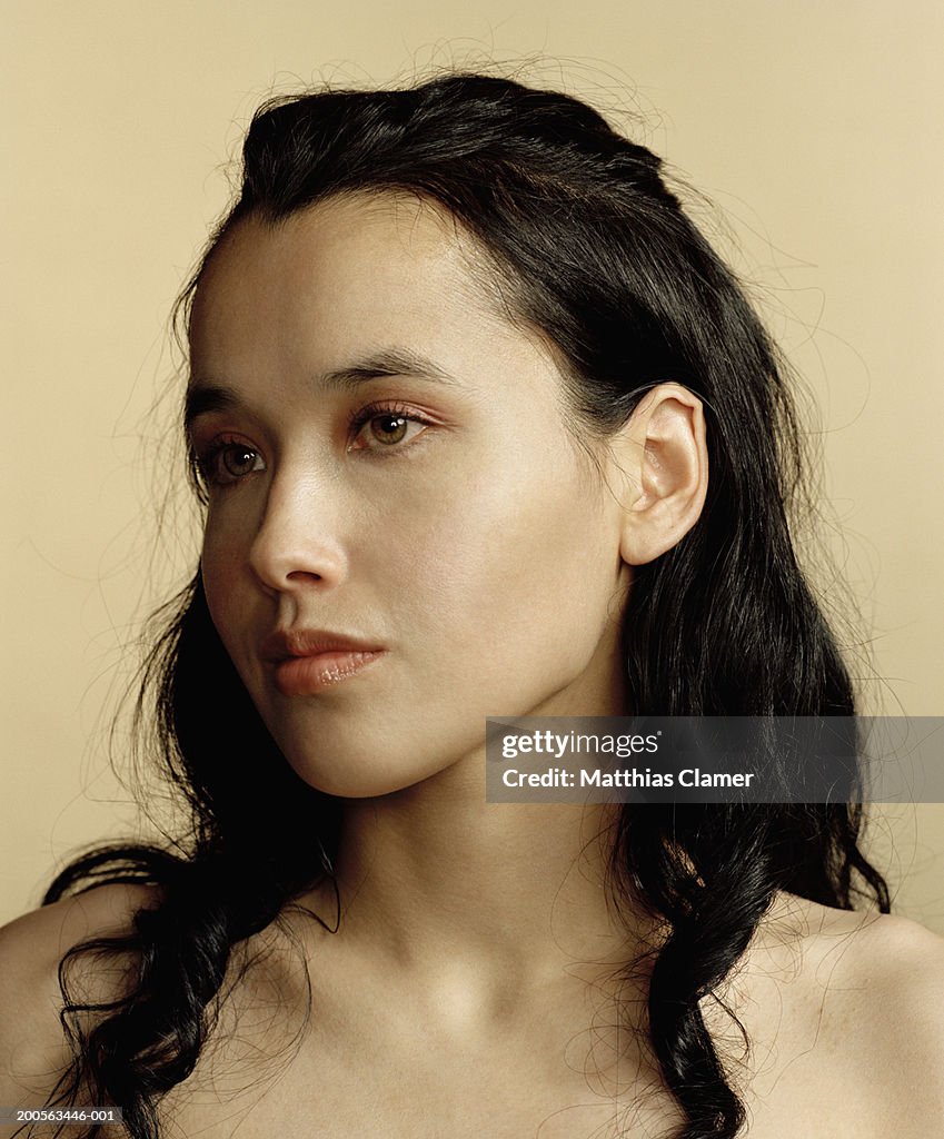 Young woman looking away, close-up