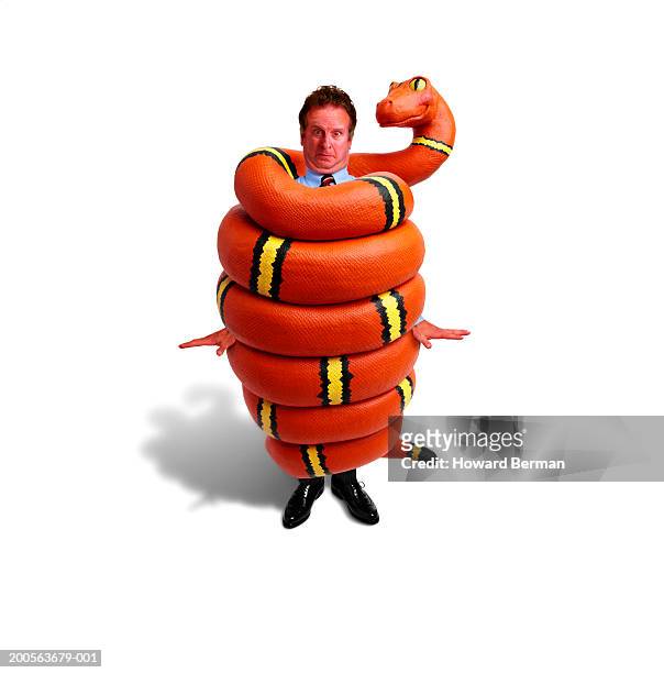 man wrapped in giant rubber snake, portrait (digital composite) - suffocated stock-fotos und bilder