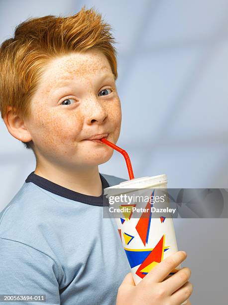 boy (10-11) drinking from cup with straw, portrait - drinking straw stock pictures, royalty-free photos & images