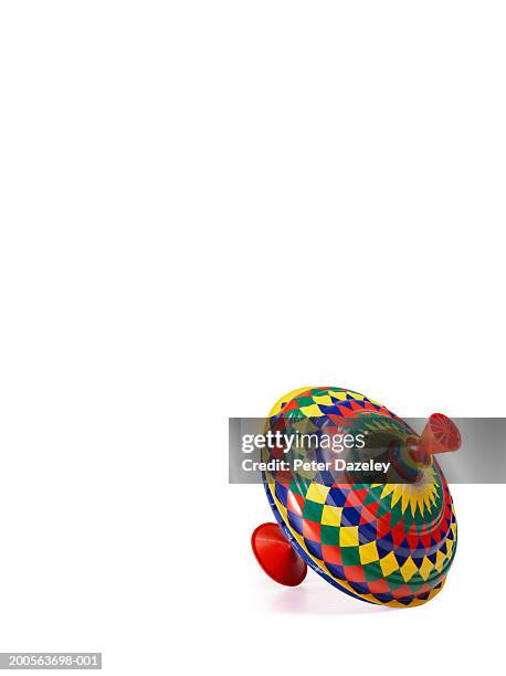 spinning top on white background - spinning top stock pictures, royalty-free photos & images